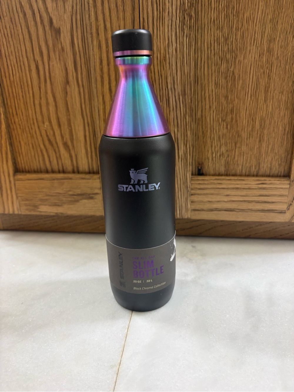 Stanley Slim Bottle in Black with Iridescent Rainbow Neck